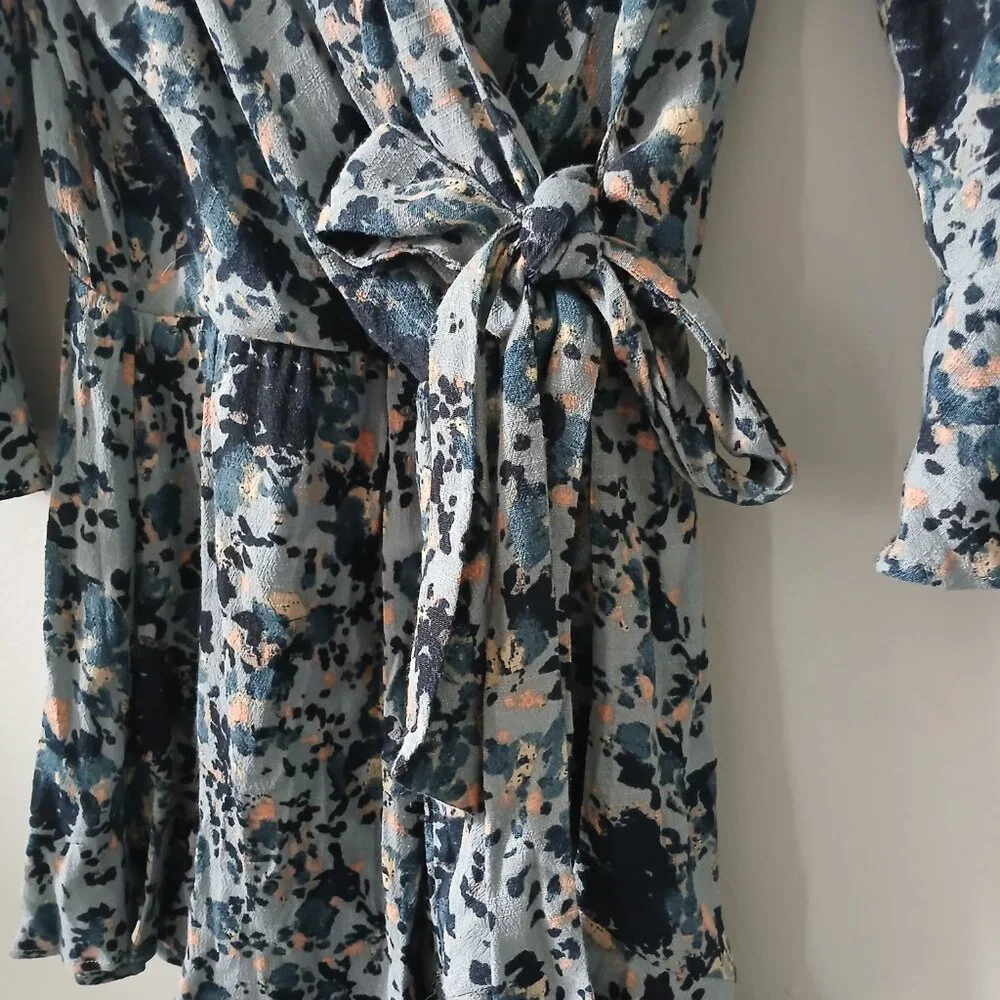 Free People Size S All the Right Ruffles Blue Floral Romper Flutter Sleeve Vneck